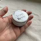 Pin Badge - Hand holding stacked badges